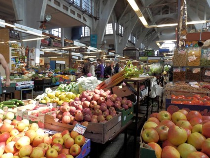 Lively market in the Wroclaw Market Hall with a variety of fresh fruit and vegetables, boxes with