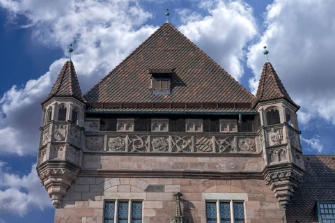 Corner tower of the Nassau house with coat of arms frieze, historic medieval residential tower,
