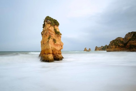 Rocks on the coast in the surf, Praia Dona Ana, Lagos, Algarve, Portugal