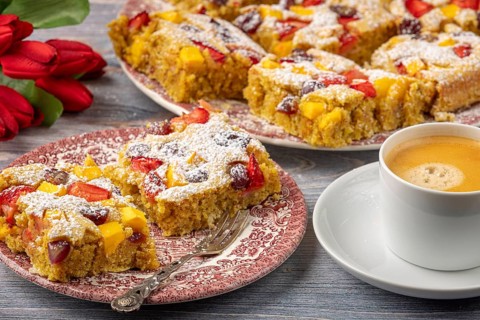 Plate of fruit cake served with coffee