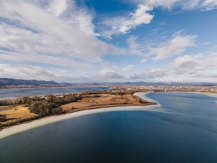 Aerial view of the Mettnau peninsula near Radolfzell on Lake Constance at low tide, the Hegauberge