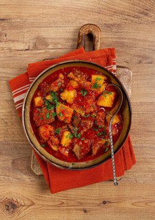 Potatoes with meat, stewed in tomato sauce, with spices and herbs, homemade, no people