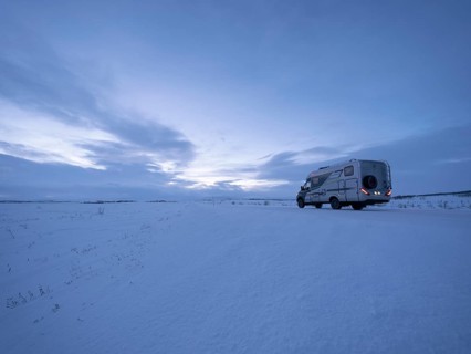 Motorhome on the arctic tundra plain in winter, Finnmark, Norway
