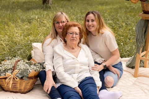 A heartwarming image featuring three generations of women, grandmother, mother, and daughter