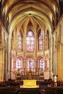 Interior view of the Romanesque Saint-Jean Cathedral, colorful stained-glass windows, handicrafts,