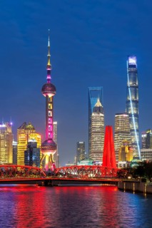Shanghai skyline at the Bund with Oriental Pearl Tower city centre downtown at night in Shanghai,