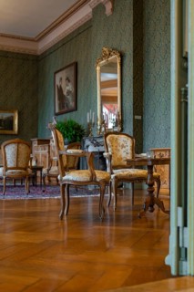 Elegant room with classic furniture and green wallpaper, creates a cosy atmosphere, Switzerland