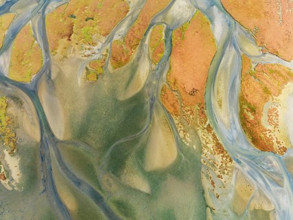 Streams at low tide in the marshland of the Walvis Bay lagoon. Aerial view. Drone shot. Walvis Bay,