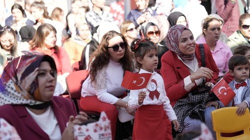Children celebrate the 102nd anniversary of the Republic Day of Turkey, a national holiday