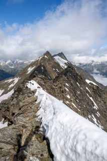Rocky summit with snow, summit of the Schönbichler Horn, Berliner Höhenweg, Zillertal Alps, Tyrol,
