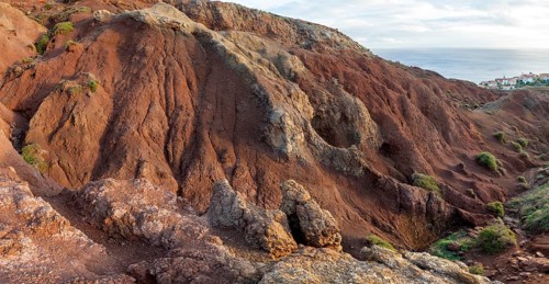 Volcanic soil, colorful soil, red, erosion, near Miradouro da Ponta do Rosto, Madeira, Portugal