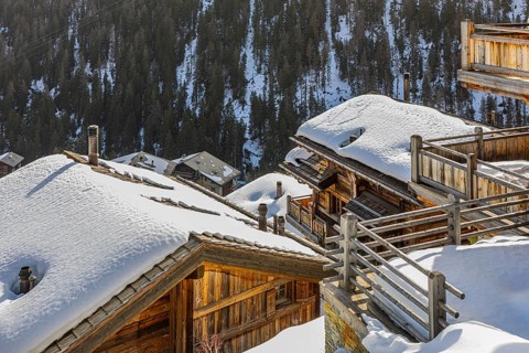 Snow-covered roofs and balconies, modern wooden holiday homes, Grimentz, Val d'Anniviers, Valais