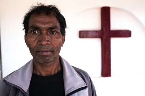 Portrait of a christian man in tribal Odisha, India. He is a disciple of the Church of North india.