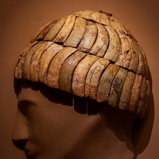 Ancient helmet, grave gift, antique ivory headpiece in detailed structure on model head, Pylos