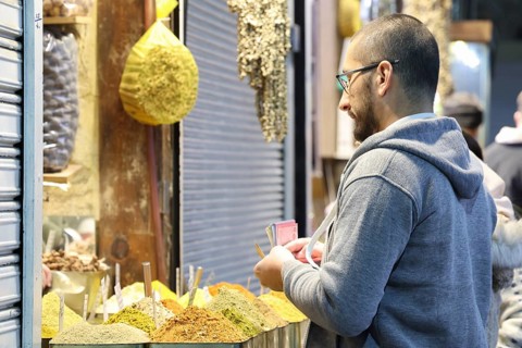 Syrians shop at the historic Al-Hamidiyah Bazaar adjacent to the Umayyad Mosque during the early