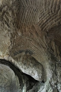 Grooves in the sandstone rock from carving millstones at the Hohllay cave in Berdorf, Little