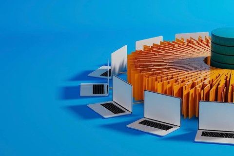 Multiple laptops surround a central data hub, showcasing technology integration for artificial