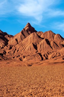 Vivid and textured red rock formations dominate the landscape of Desierto del Diablo (Devil's