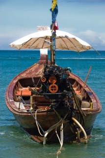 Typical Thai longtail boat on Bang Tao Beach in the northwest of the holiday island of Phuket,