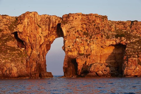 Dramatic rock formation with arches in the sea at early morning time, morning light, Tsichli Babas