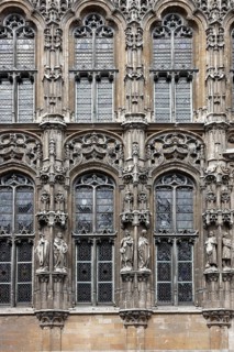 Historic town hall Stadhuis, partial view of the façade in Flamboyant Gothic style with sculptures,