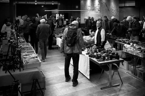 Customers and retailers, Photographica, old photo equipment, cameras, lenses, display, black and