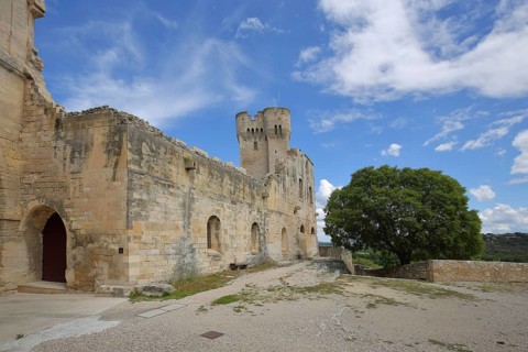 Courtyard with tower of the Romanesque monastery Abbaye de Montmajour, Benedictine monastery,