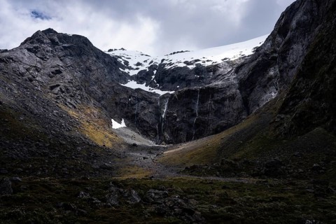 Mountainous landscape, snow-capped Mount Talbot seen from Milford Road. Fiordland National Park,