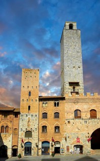 The Piazza Duomo (Cathedral Square) of San Gimignano with its medieval towers built as defensive