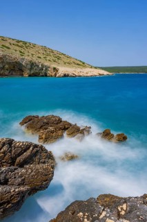 Romantic view over the sea in Koromacna Bay on a sunny day with rough seas on the island of Cres,