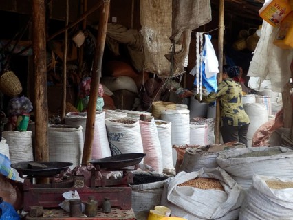 Sacks of goods and a scale visible on a lively market, Harar, Ethiopia