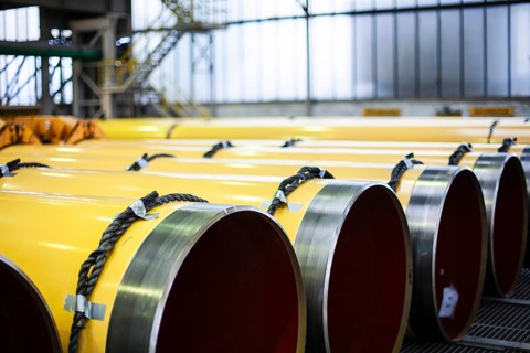 A series of large yellow pipes in an industrial building, Düsseldorf, Germany
