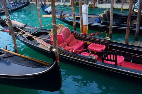 Gondola with red seat cushions, Venice, Veneto, Italy