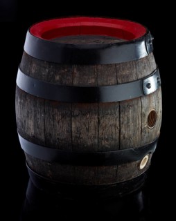 Beer keg against black background, studio shot against black background