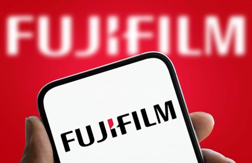 Fujifilm logo is displayed on smartphone. Fujifilm Holdings Corporation is a Japanese multinational