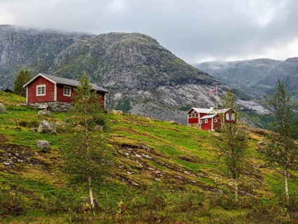 Typical red norwegian holiday cottages, Jostedal valley, Norway