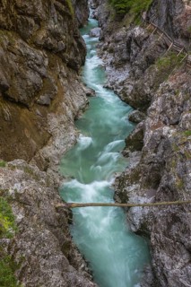 The Lammer creek is flowing fast through the Lammerklamm on a sunny hiking day