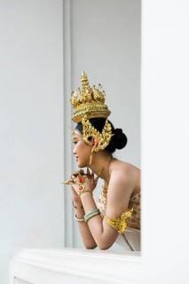 Thai traditionally and festively dressed young woman, Wat Pho, Bangkok, Thailand