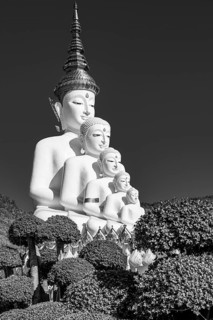 Five-headed Buddha statue, black and white photo, Wat Phra That Sorn Kaew Buddhist temple complex,