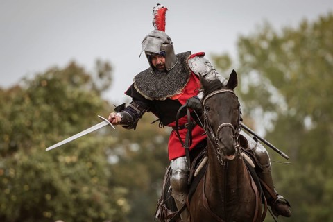 LUBIAZ, POLAND - AUGUST 25, 2018: Monastery Siege - historical staging. Knights horse riding show