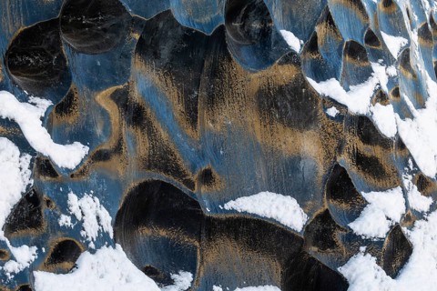 Structures in glacial ice, ice cave, glaciers, black glaciers reflecting sunlight, snow,
