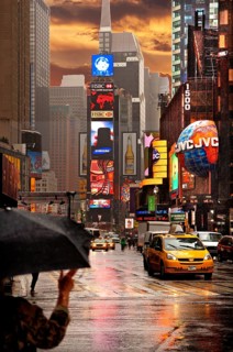 Evening Times Sqaure with illuminated advertising in the rain, New York City, USA