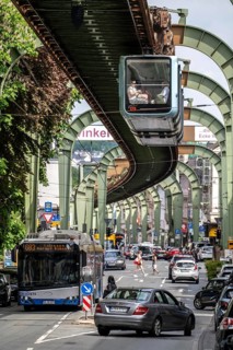Train of the Wuppertal suspension railway runs along Kaiserstraße in the Wuppertal-Vohwinkel