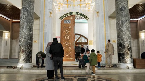 Muslims perform Tarawih prayers at the Millet Mosque, the second largest mosque in Turkey, which is