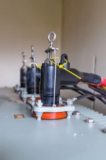 Close-up of electrical connections on a transformer, switch cabinet construction, PV system