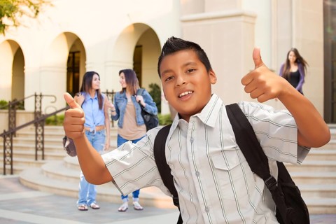 Young Male Hispanic Student Boy with Thumbs Up on Campus