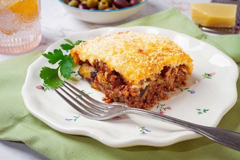 Greek dish moussaka, baked eggplant with minced meat, with bechamel sauce, home cooking