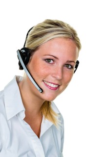 Young woman with headset on the phone in the office taking orders. Hotline and customer service,