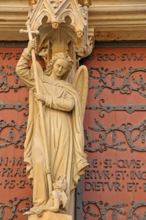 Sculpture of the Archangel Michael with lance and cross at the portal of the Virgin Mary, Gothic