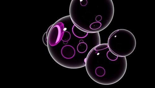 A 3D render featuring multiple black spheres with purple glowing highlights against a dark